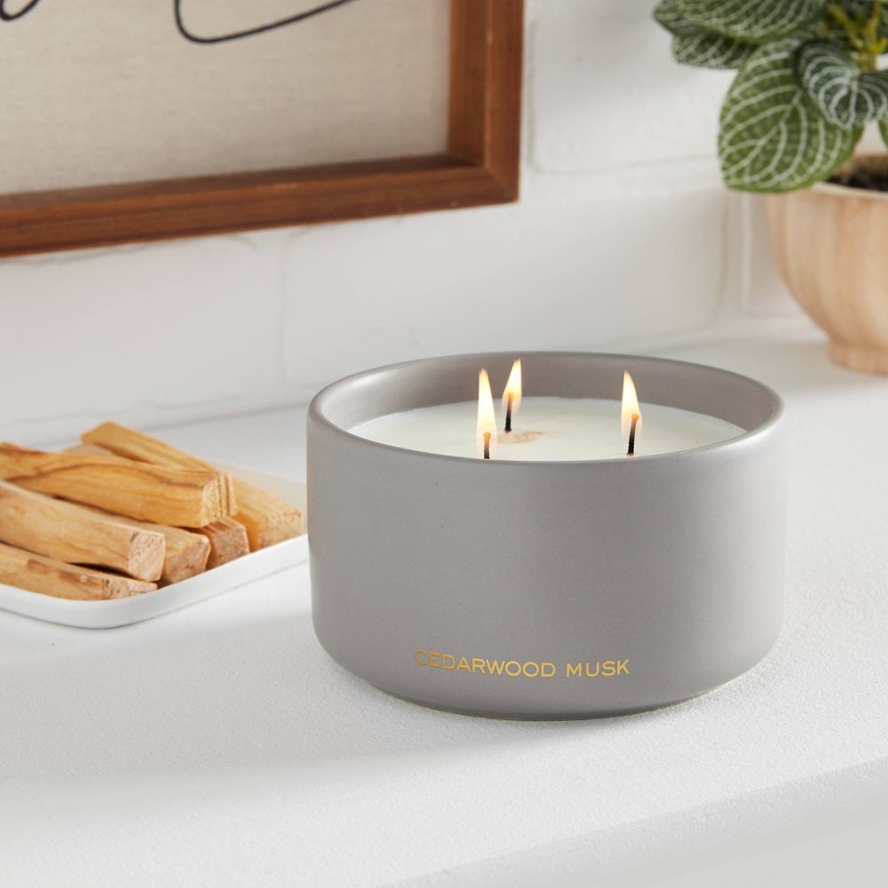 gray candle in cedar wood musk scent